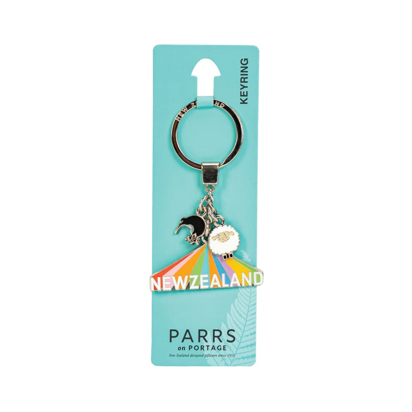 Keychain with rainbow and kiwi bird and sheep design on a PARRS packaging
