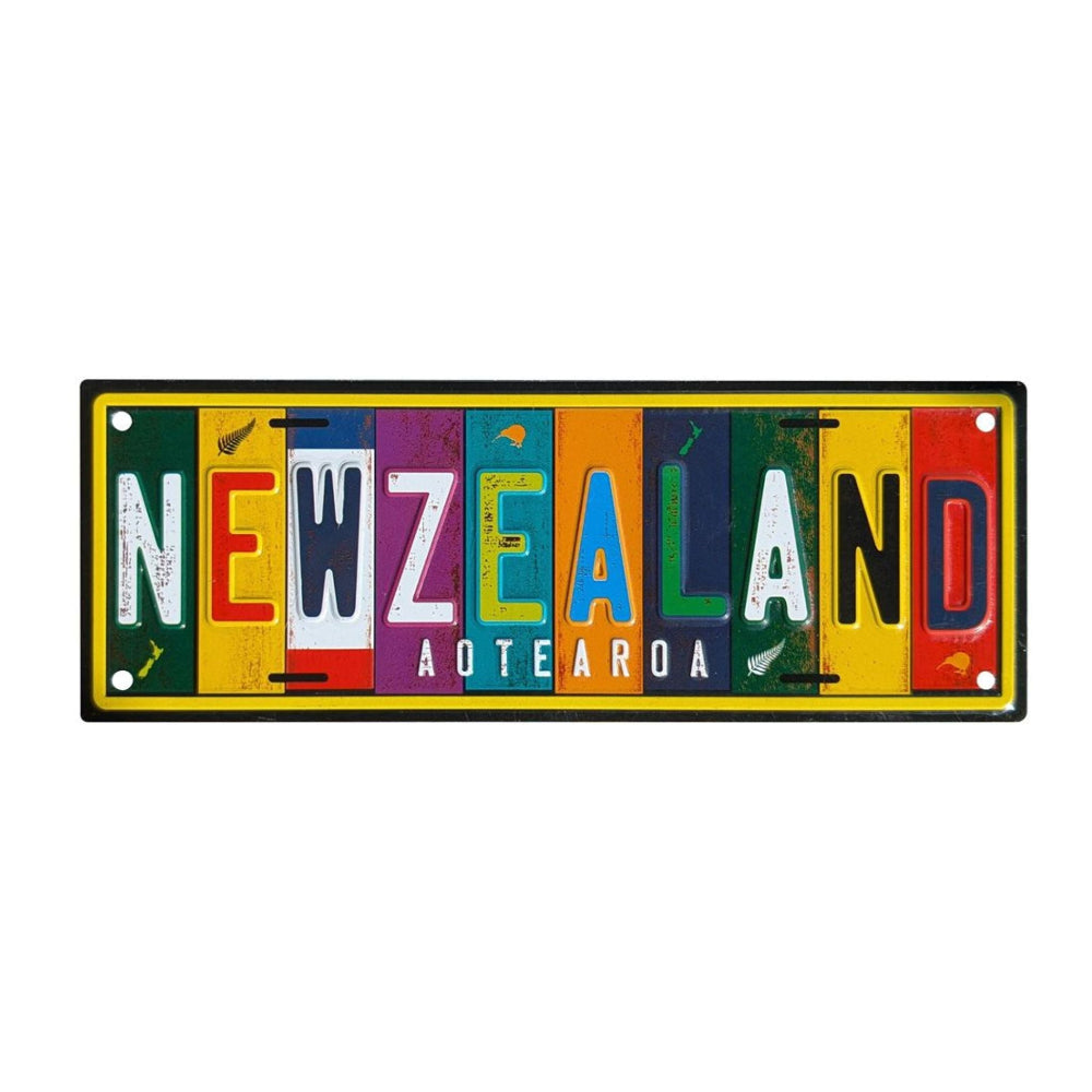 Colorful license plate-style sign with 'NEW ZEALAND AOTEAROA' text on a white background