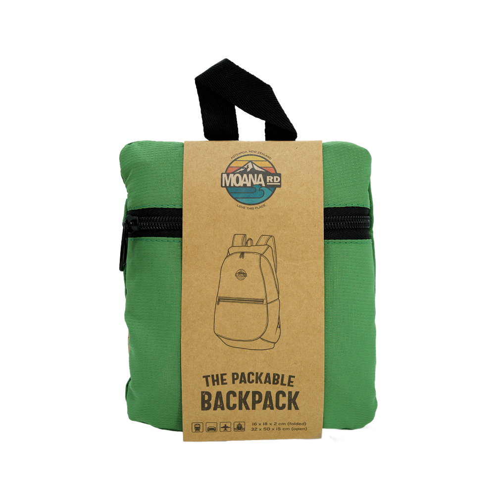 Green packable backpack with a brown cardboard label on a white background