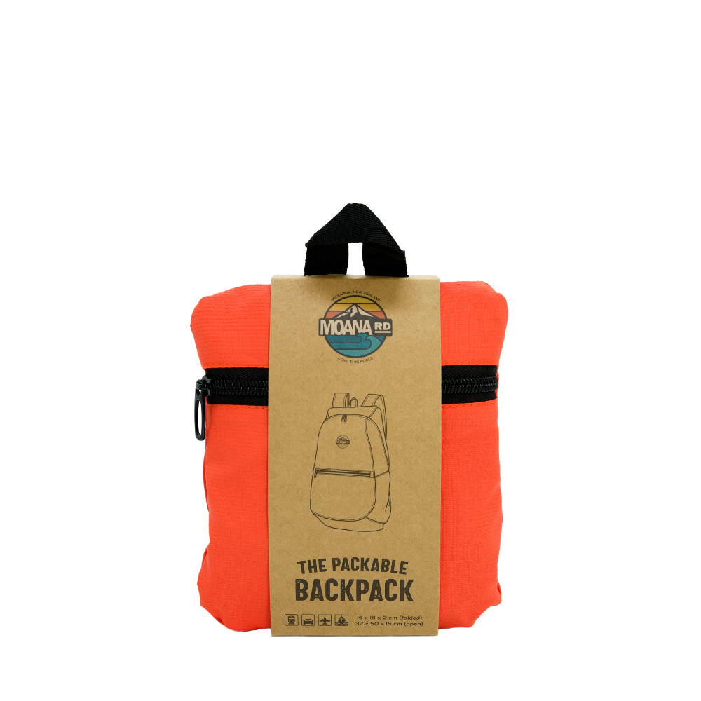 Orange packable backpack with cardboard sleeve and Moana Rd logo on a white background