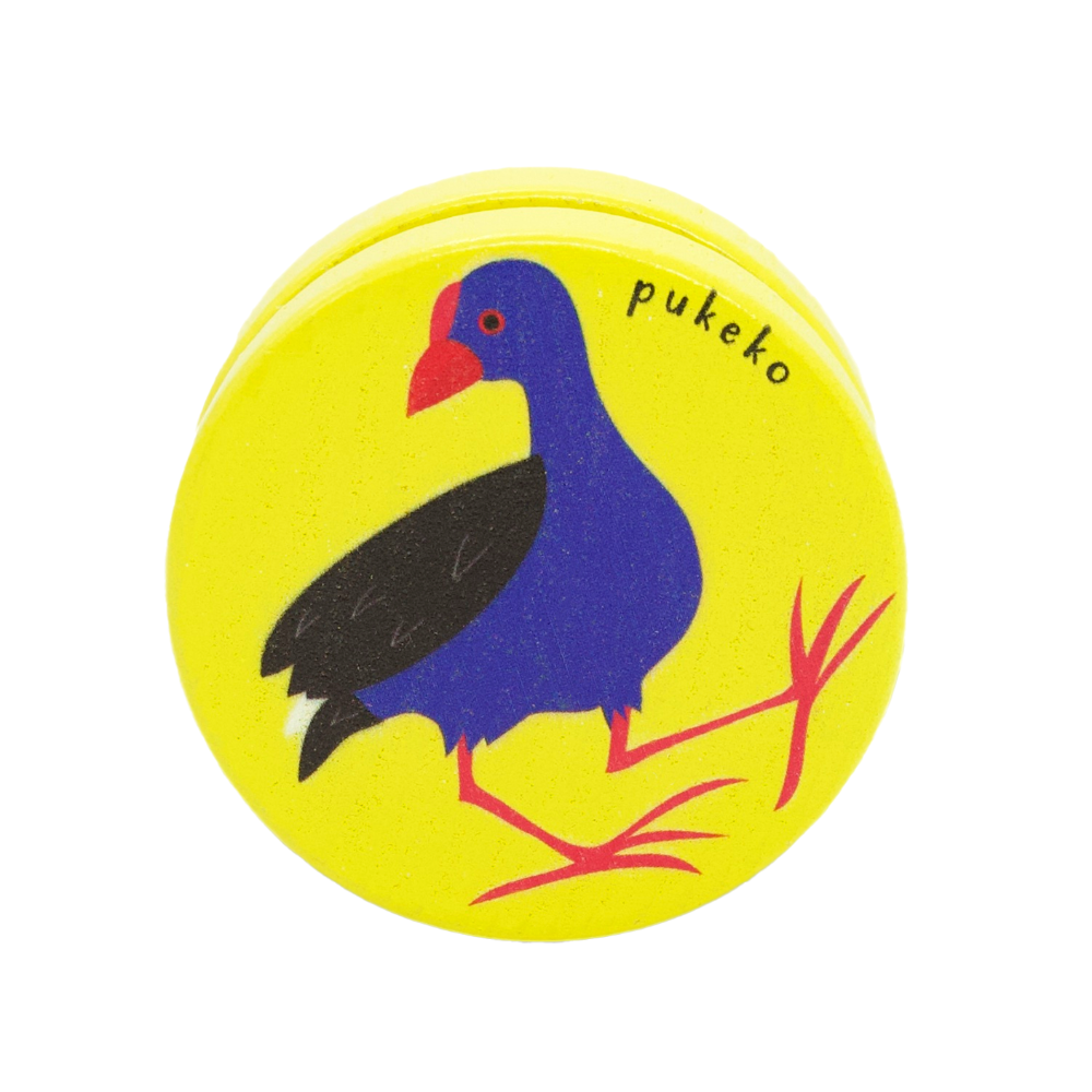 Round yellow yoyo with a purple pukeko design on a white background