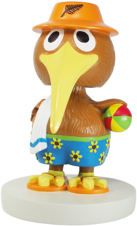 Cartoon-like kiwibird figurine wearing a hat and shorts, holding a beach ball, on a white background