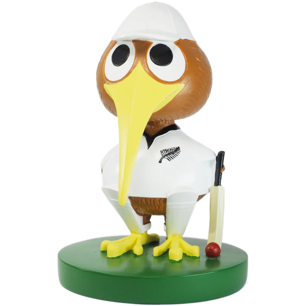 Figurine of a bobblehead kiwi bird in cricket attire on a white background