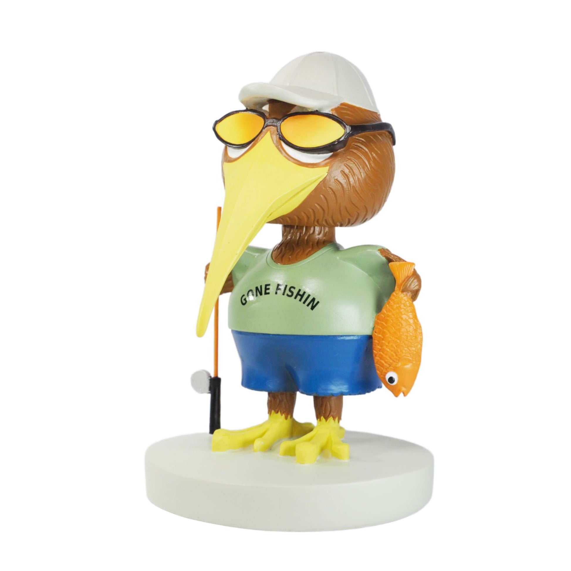 Figurine of a kiwi bird wearing sunglasses, a cap, and a ' Gone Fishing' shirt on a white background.