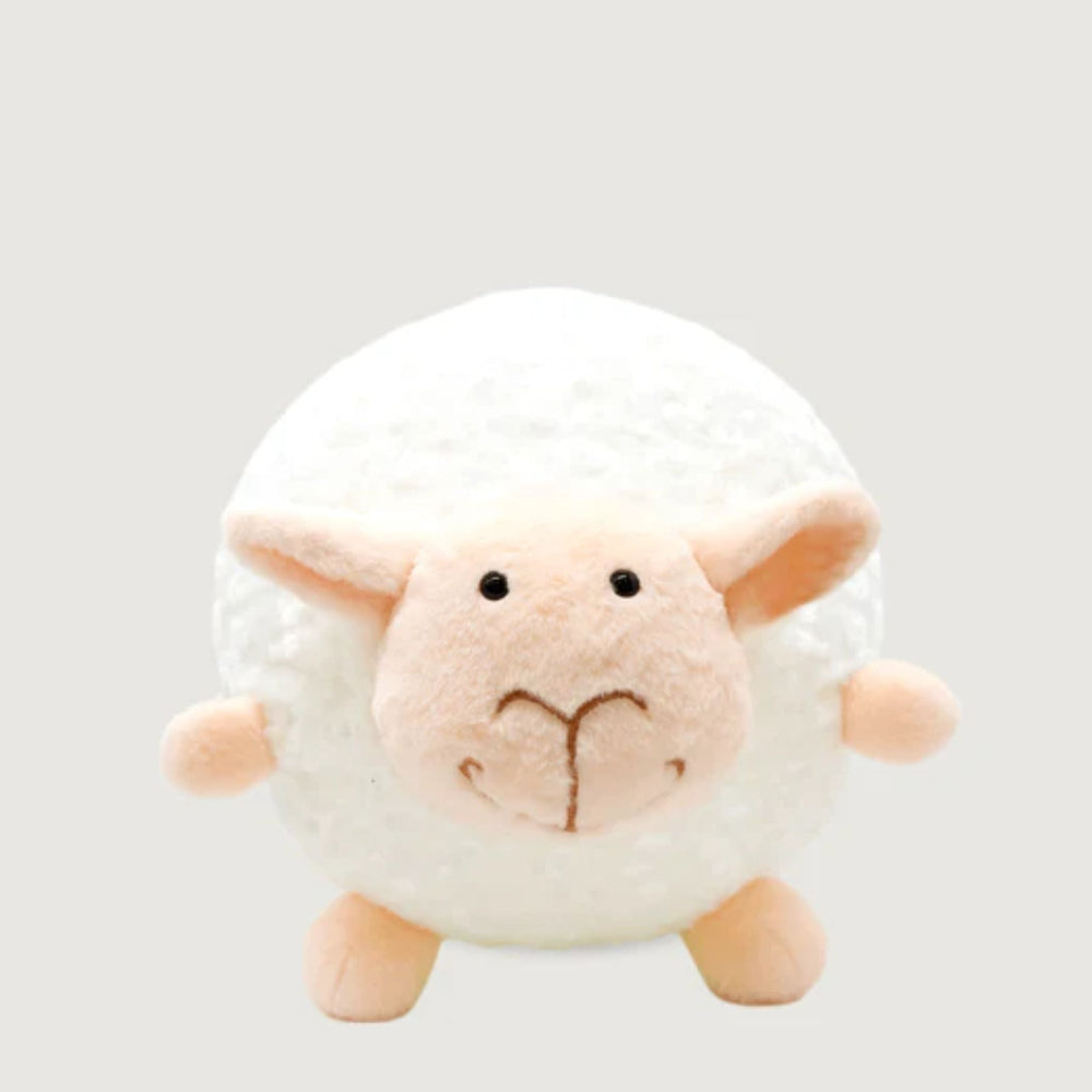 Plush toy sheep on a light gray background