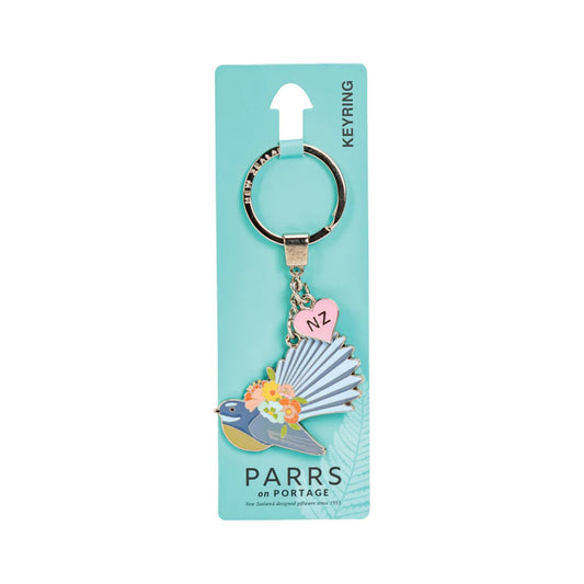 Keychain with fantail bird design on a blue card with 'Parrs on Portage' branding.
