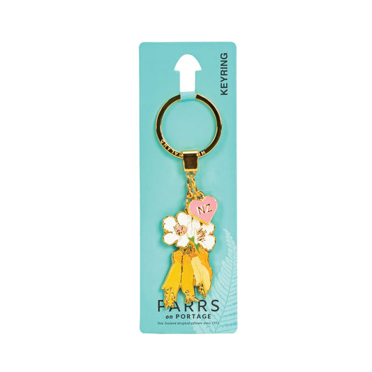 Key Ring-Metal Manuka & Kowhai Flowers on a green card on a white background