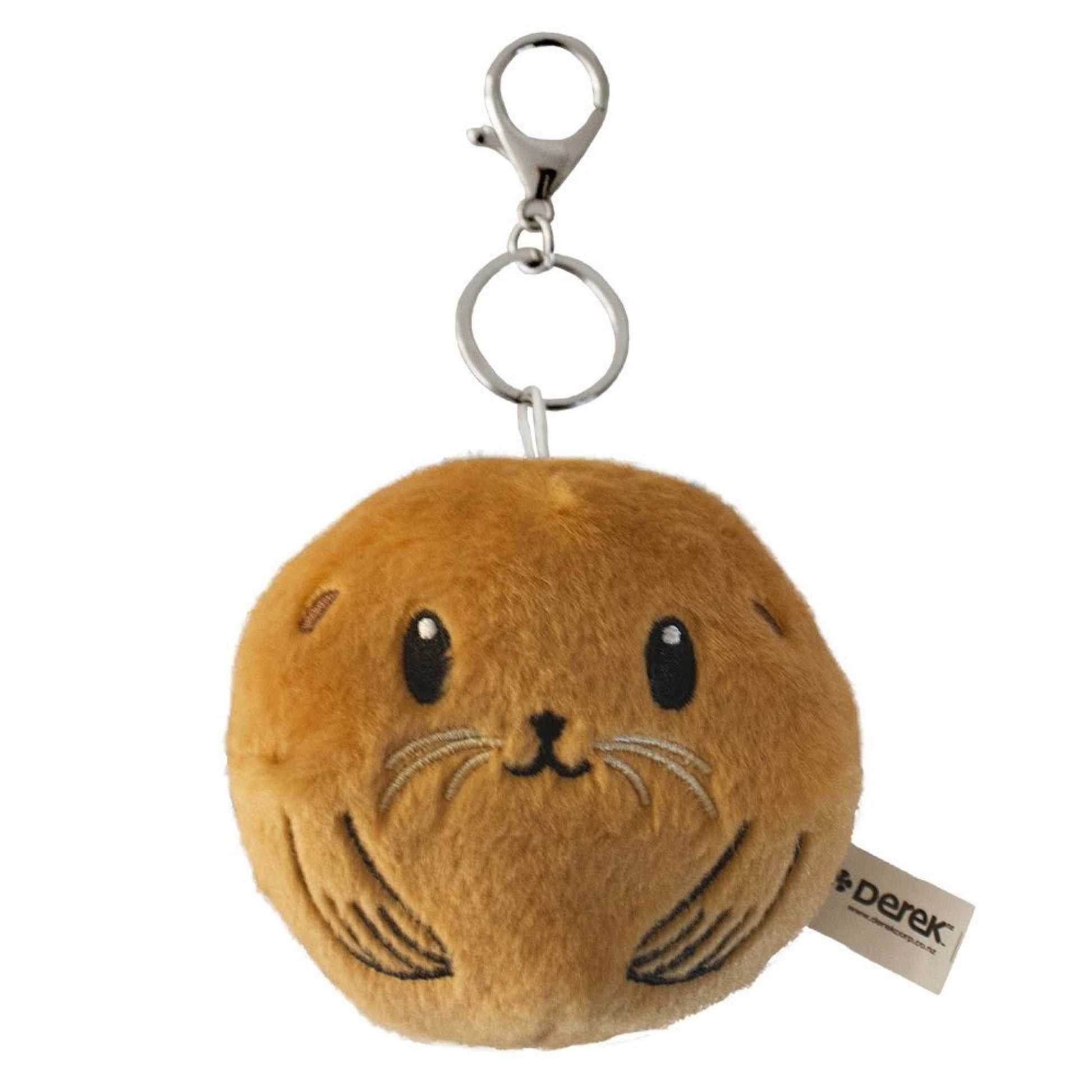 Plush keychain in the shape of a round seal with a tag on a white background