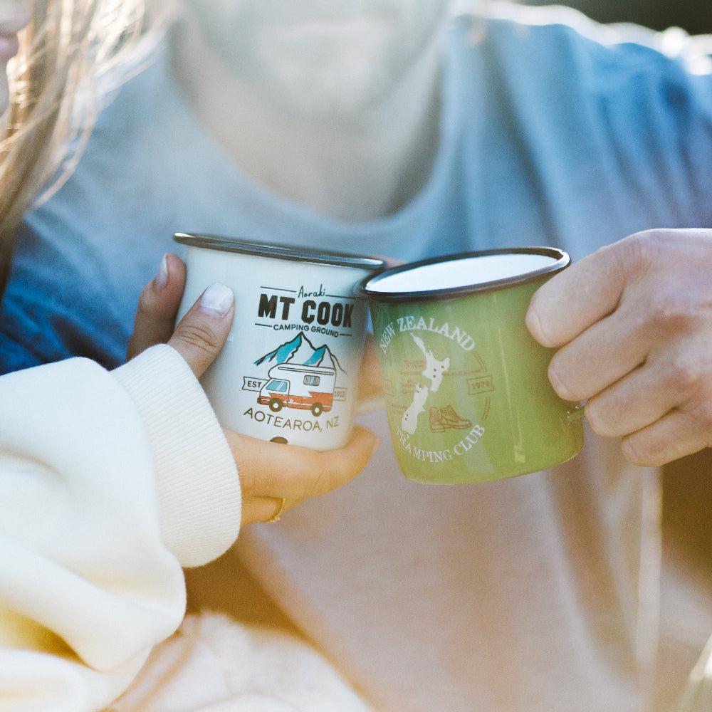 two people holding Moana Road Enamel Mugs Mt Cook