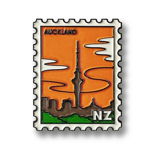 Enamel magnet with Auckland skytower design on an orange background