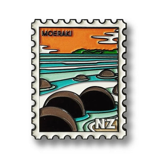 Enamel magnet with Moeraki design on a white background