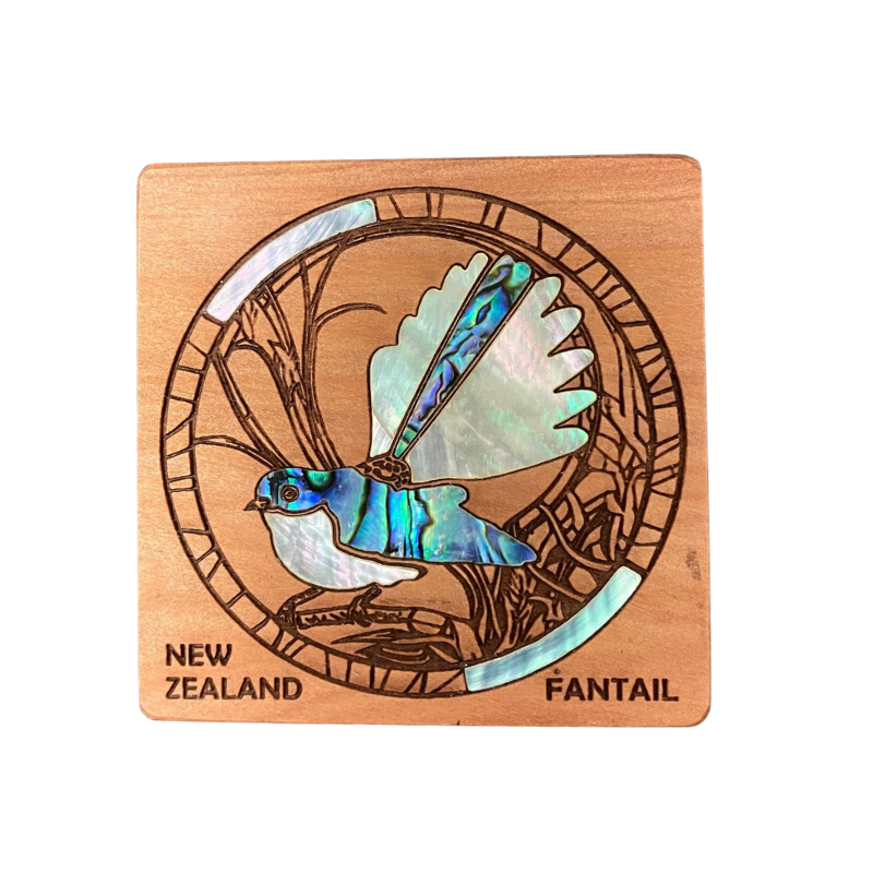 Wooden coaster with a fantail bird design and 'New Zealand Fantail' text on a white background