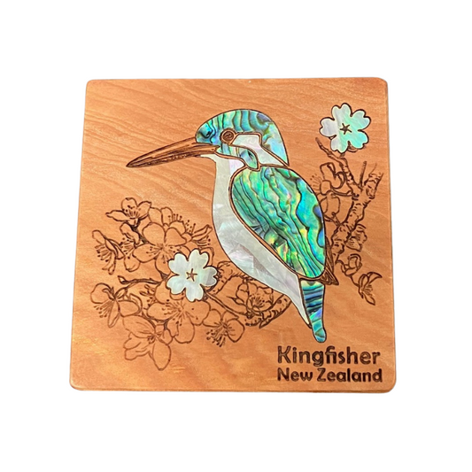 Wooden magnet with a Kingfisher design and floral elements on a white background