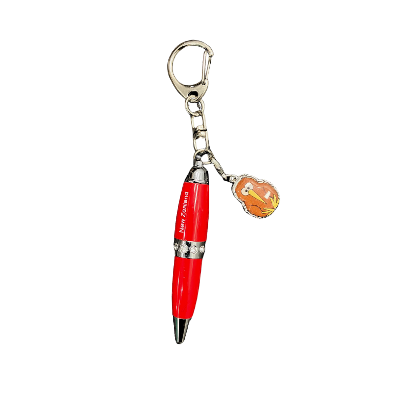A red pen key ring with a silver clasp and a small Kiwi bird charm attached.