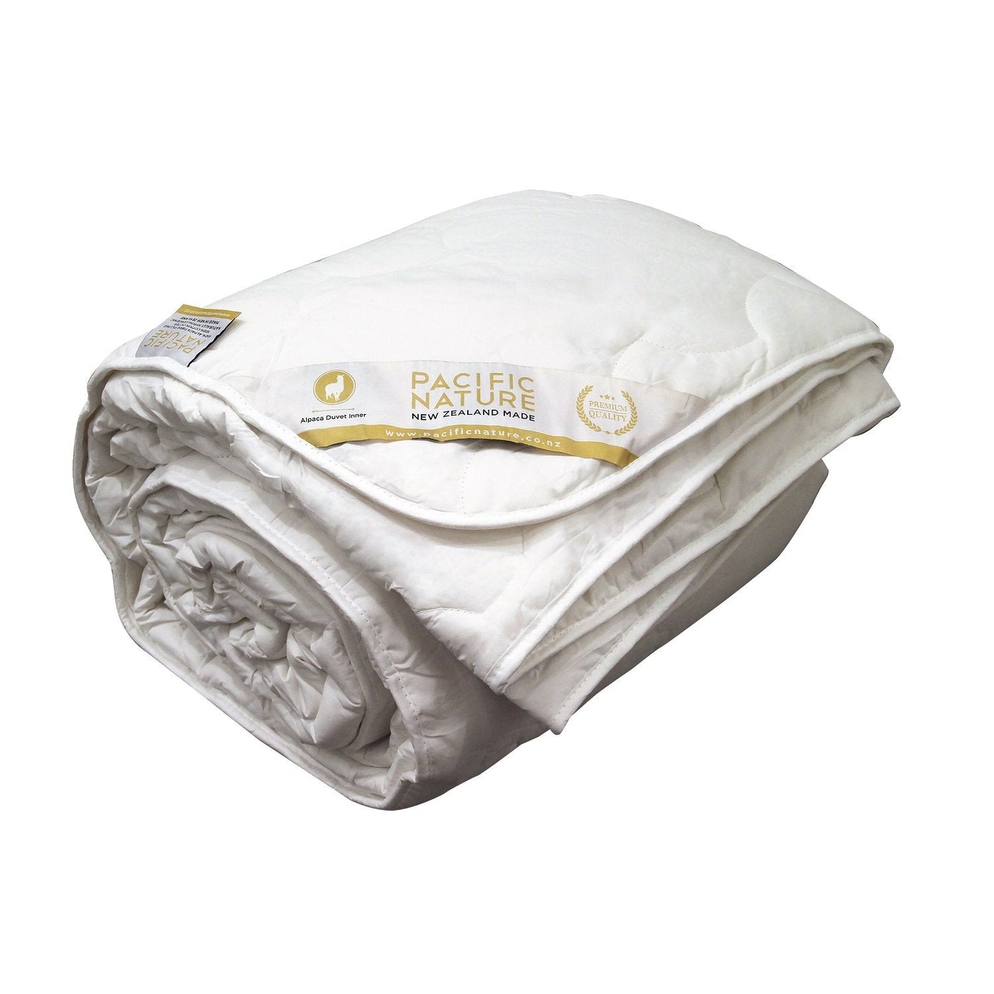 A beige Pacific Nature alpaca duvet cover displaying the brand's logo and information.