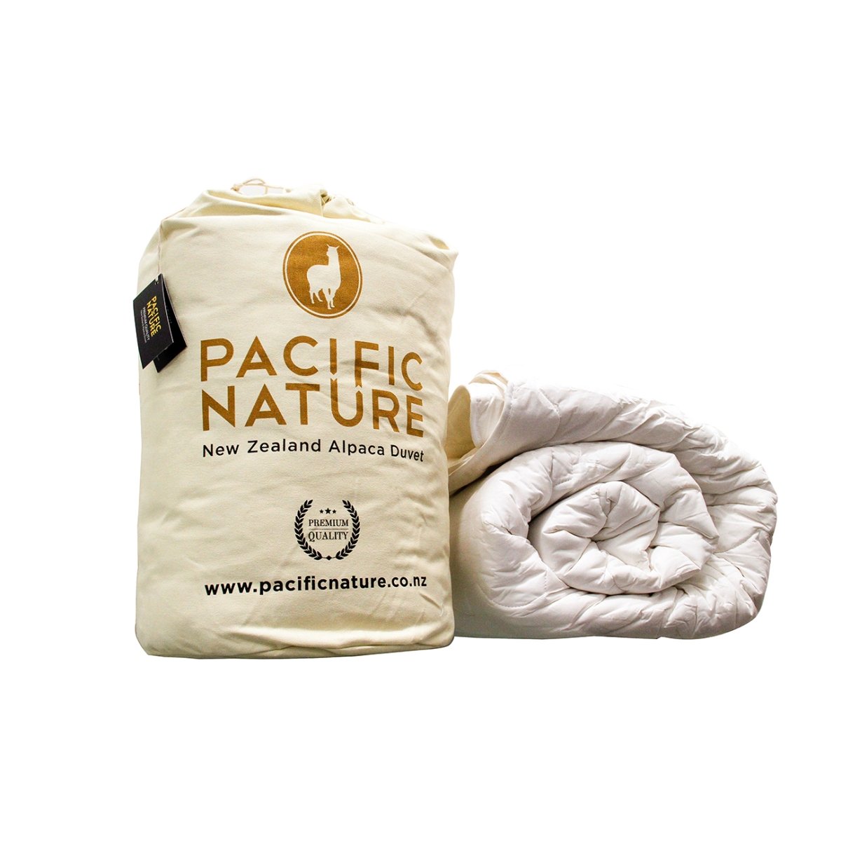 A beige Pacific Nature alpaca duvet cover and the bag displaying the brand's logo and information.