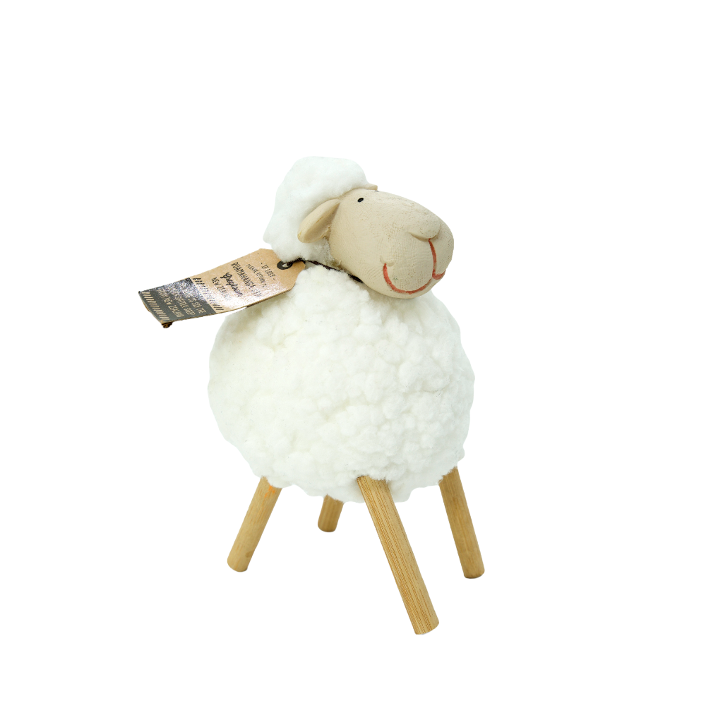 White fluffy woolly sheep Sid toy with wooden legs on a white background