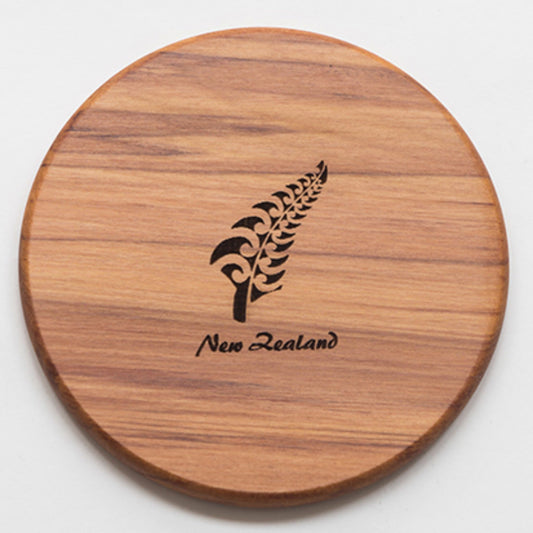 handmade silver fern Rimu coaster on a white background
